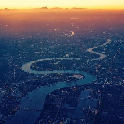 An ariel photo of London with the River Thames winding through